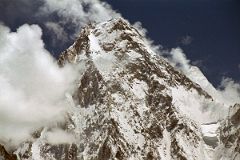 
Gasherbrum II pokes out to the right of The West Face of Gasherbrum IV shining in the late afternoon sun from Concordia.
